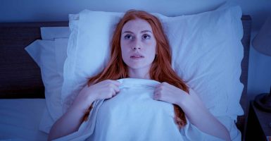 One woman suffering insomnia disturbed by noise